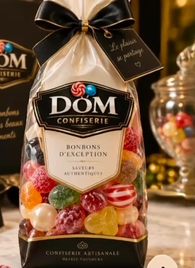 Sachet Dom Confiserie noué d'un ruban noir, bonbons acidulés et berlingots